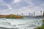 Rapids immediately upstream from American Falls. &nbsp;The Canadian city of Niagara Falls is in the background on the other side of the gorge
								on the right and Goat Island is on the left.