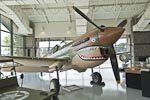 Curtiss P-40 Warhawk. &nbsp;From Pearl Harbor through 1943 the P-40 was the primary fighter of the US Army Air Force. &nbsp;P-40s served with the famous Flying Tigers in China with the paint scheme of this plane. &nbsp;The P-40 was eventually supplanted by the  P-38 Lightning, the P-47 Thunderbolt and the P51 Mustang.