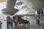 Cousin Doug, Lelah, and Denise patiently stand below the pontoon of the left wing of the Spruce Goose. &nbsp;Note the four engines on left wing. &nbsp;The wing and engine to the right belong to the Douglas DC-3A.