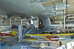 A rear view of the Douglas DC3-A from the top of the stairs at the entrance of the Spruce Goose. &nbsp;The white wooden-prop biplane in the foreground is an Oldfield "Baby Great Lakes" and the orange monoplane to its right is a Curtiss Robin B.